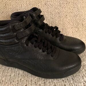 Reebok women’s black high top running shoes, size 6.